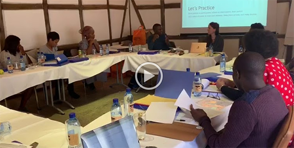 The team of Khoekhoe speakers discuss the proper translation for a survey item, in Khoekhoe, during our training in Windhoek