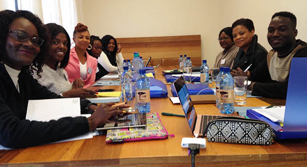 The team of Khoekhoe speakers discuss the proper translation for a survey item, in Khoekhoe, during our training in Windhoek
